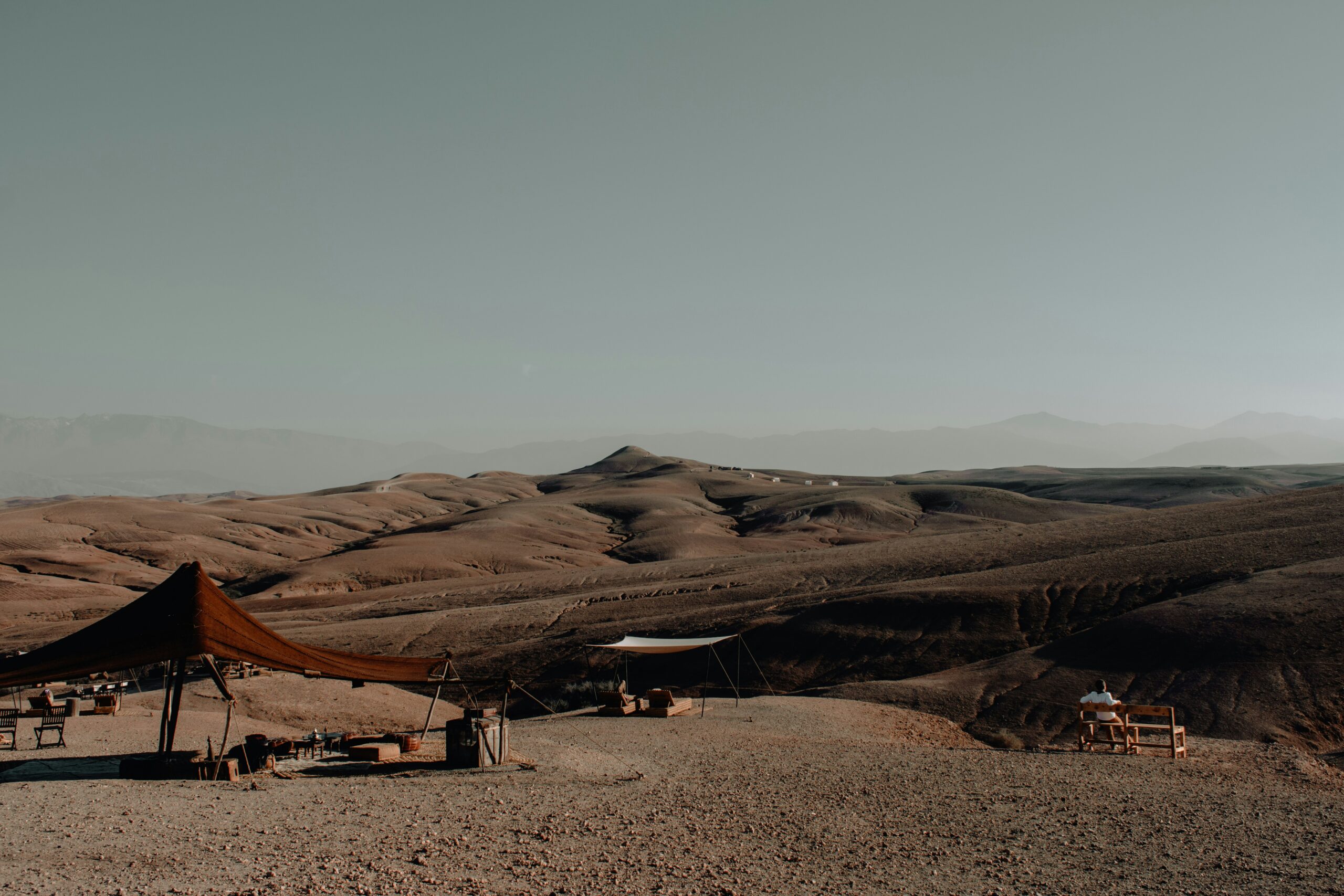 Luxury desert camp overlooking the Agafay Desert landscape near Marrakech Morocco