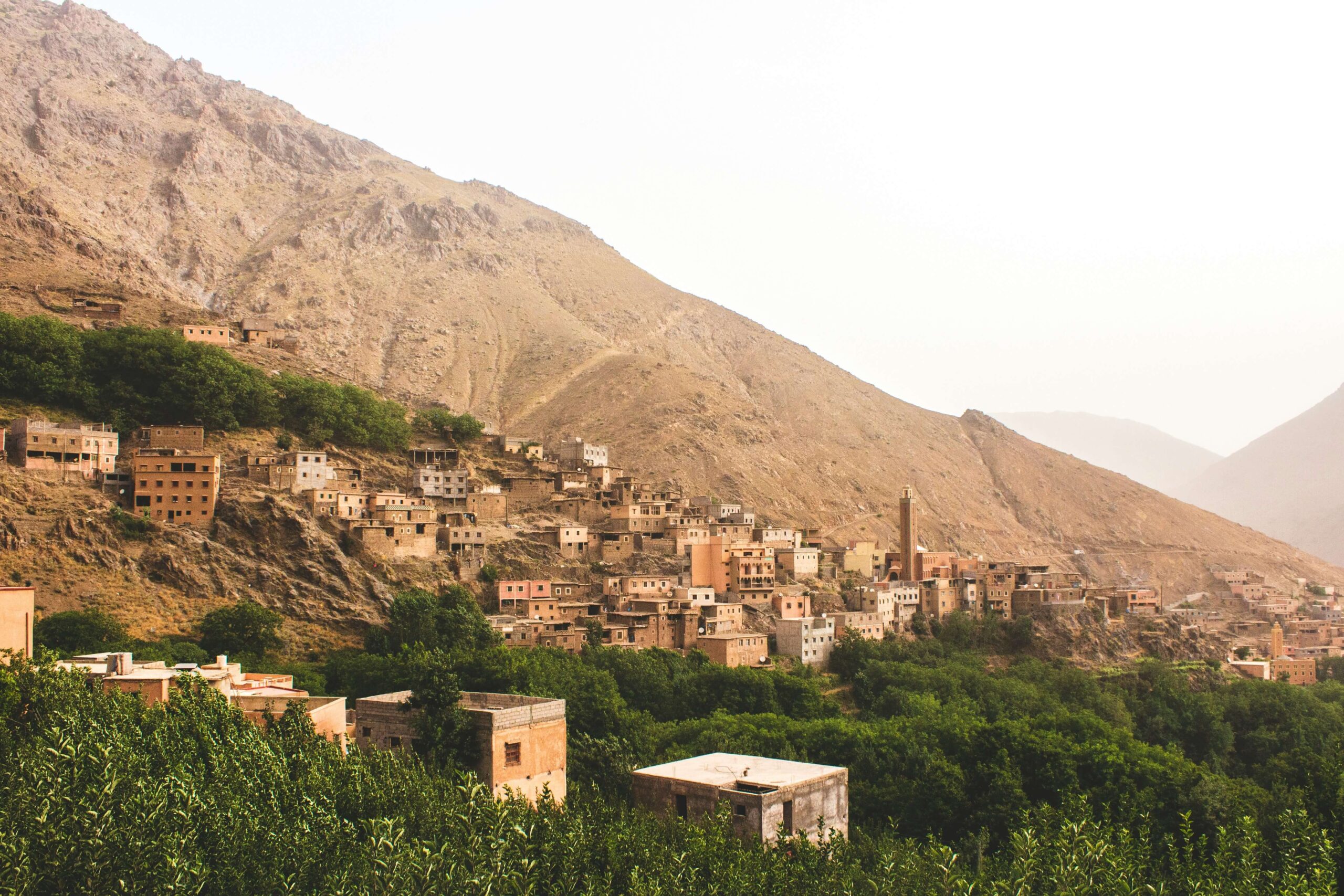 Traditional Berber village built on mountain slope in the High Atlas Mountains Morocco